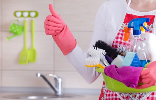 Cleaner preparing a carpet steam cleaning visit in Ealing
